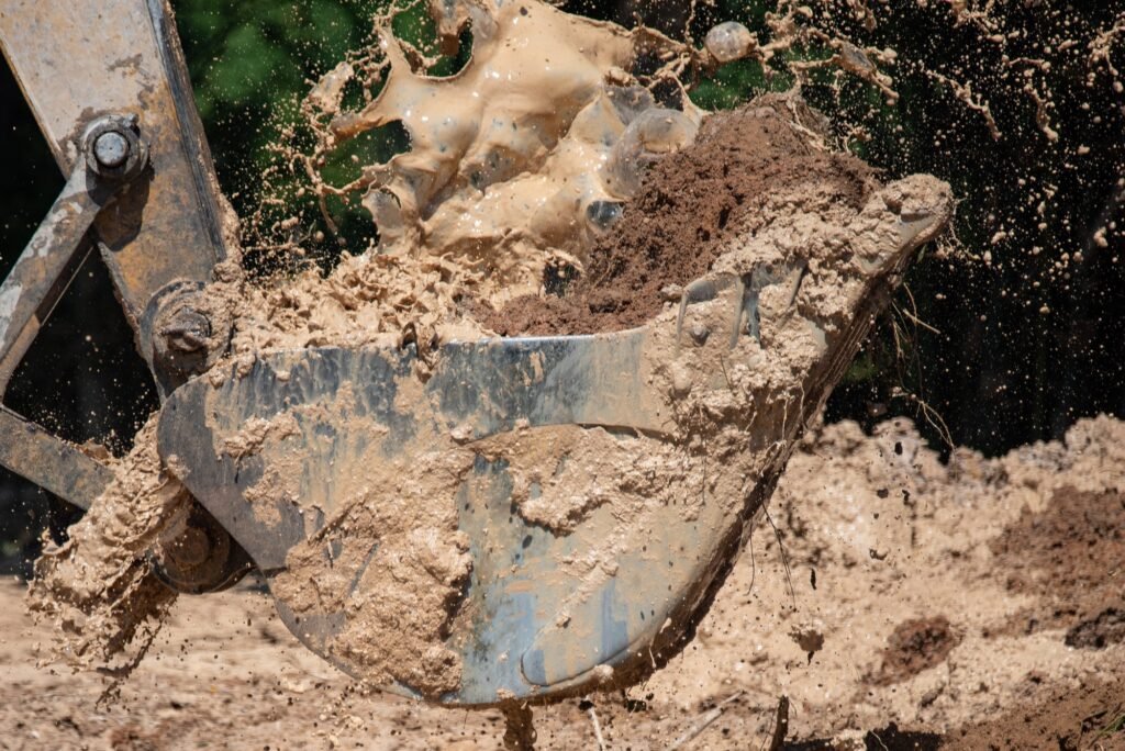 bulldozer machine digging the ground and removing sand for excavation purpose